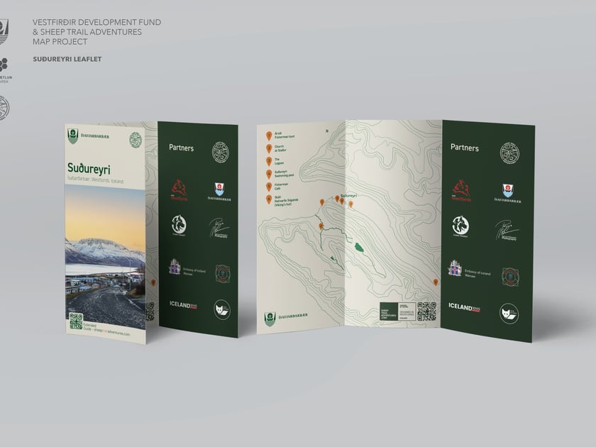 Printed leaflet mock-up showing a map of Suðureyri and partner information